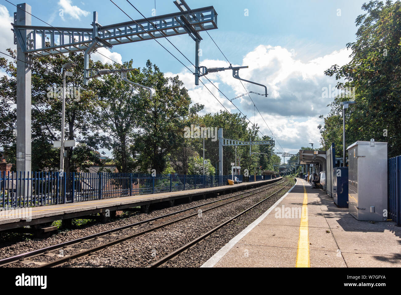 Strong metal gantries carry overhead power cables to power trains at