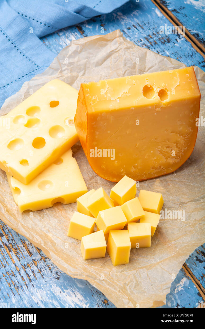 Famous hard cheeses, Dutch Gouda and French Emmentaler in pieces and