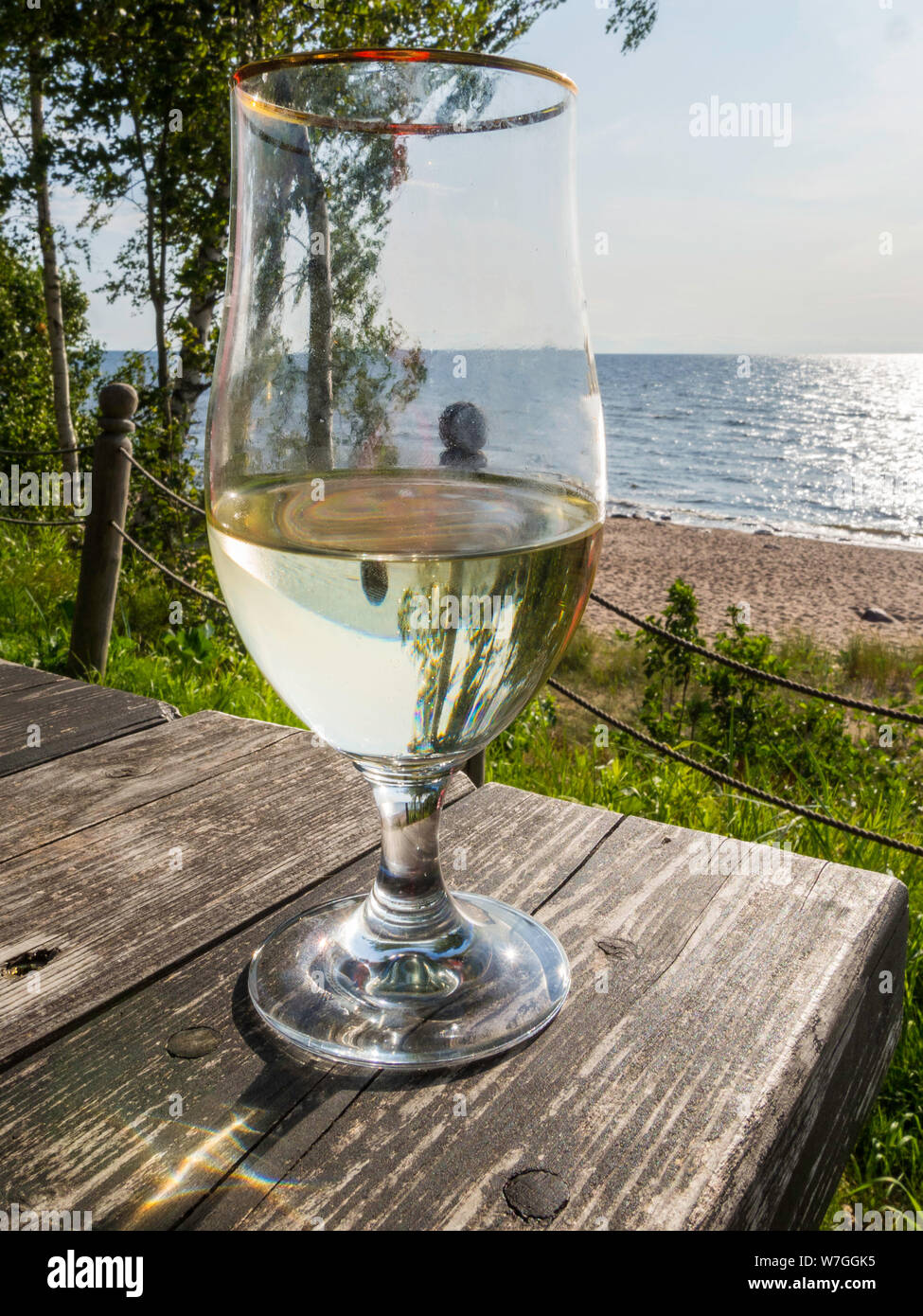 Glass of wine and a beautiful view on the sea, beach Stock Photo - Alamy