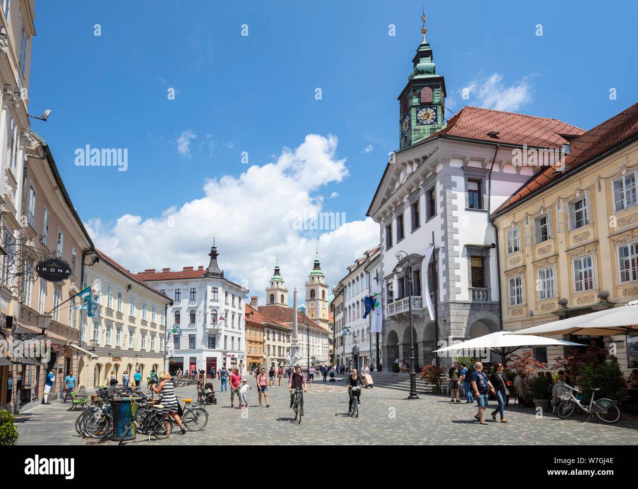 People tourists and cyclists in the Town Square in front of the Ljubljana Town Hall Stritarjeva ulica Old Town Ljubljana Slovenia Eu Europe Stock Photo