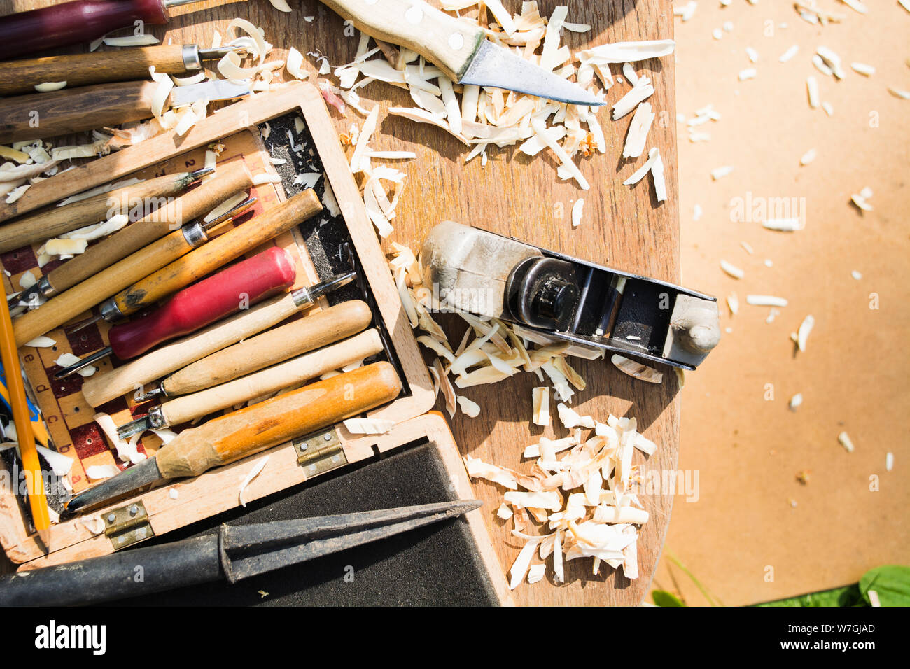 Wood carving tools. Hanmade hobby concept with cutters. Wood shavings