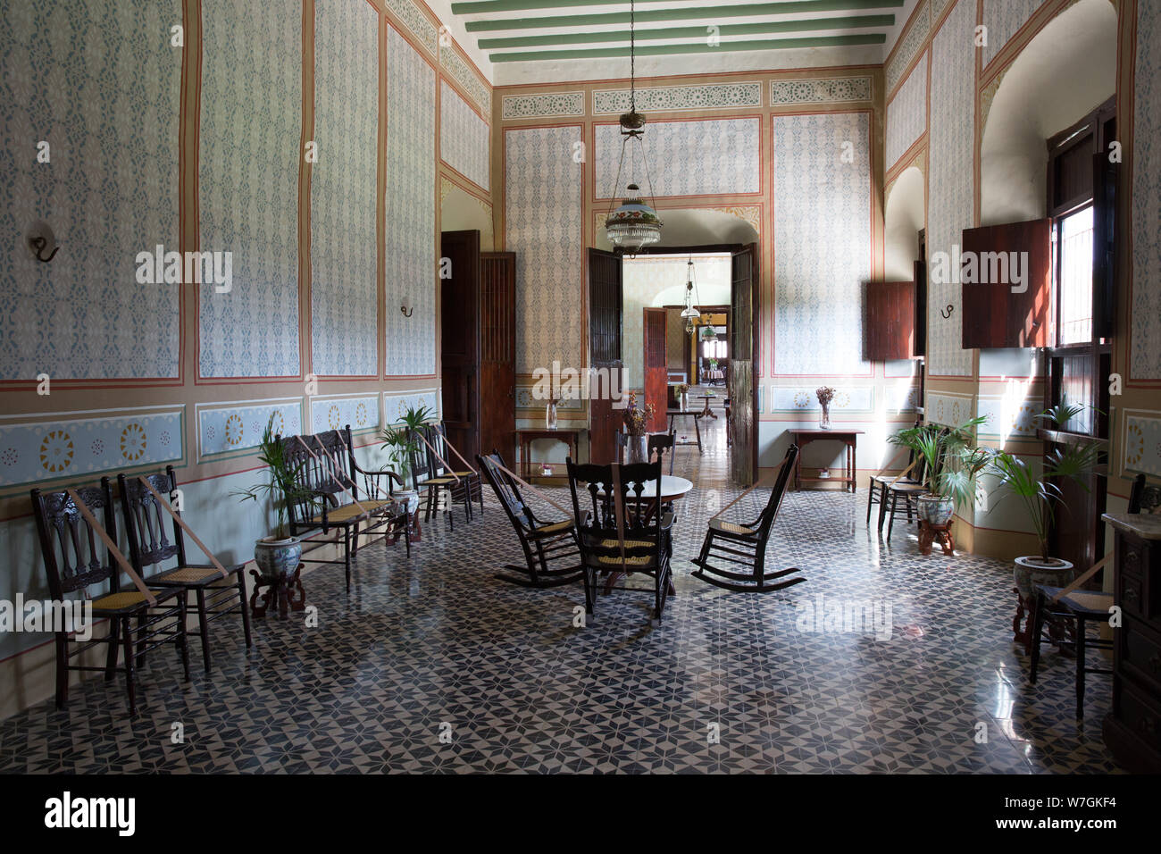 Rooms with colonial antique furniture in the main house of Hacienda Yaxcopoil in the Uman Municipality, state of Yucatan, Mexico on July 22, 2019. Hacienda Yaxcopoil dates back to the 17th century and was once considered one of the most important rural estates in the Yucatan, spreading across 22,000 acres. It operated first as a cattle ranch and later as a henequen plantation during the golden age of the 'agave sisal'. Over time, due to continuous political, social and economic changes, the estate has been reduced to less than 3% of its original size. The production of henequen fiber in the ha Stock Photo