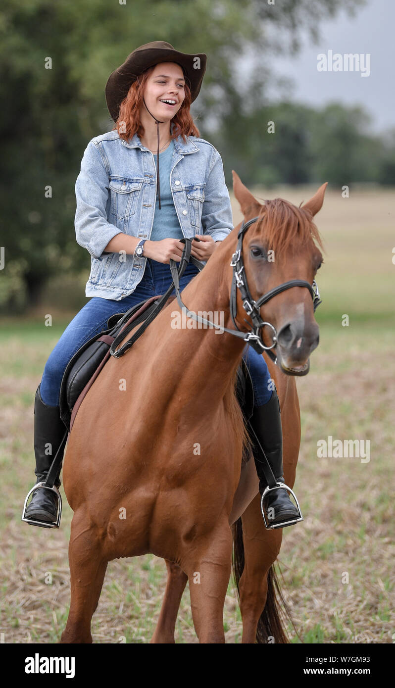 Reichenow, Germany. 06th Aug, 2019. On the press date on the set of the  Amazon series Bibi and Tina the actress Harriet Herbig-Matten sits as Tina  on a horse. The shooting of