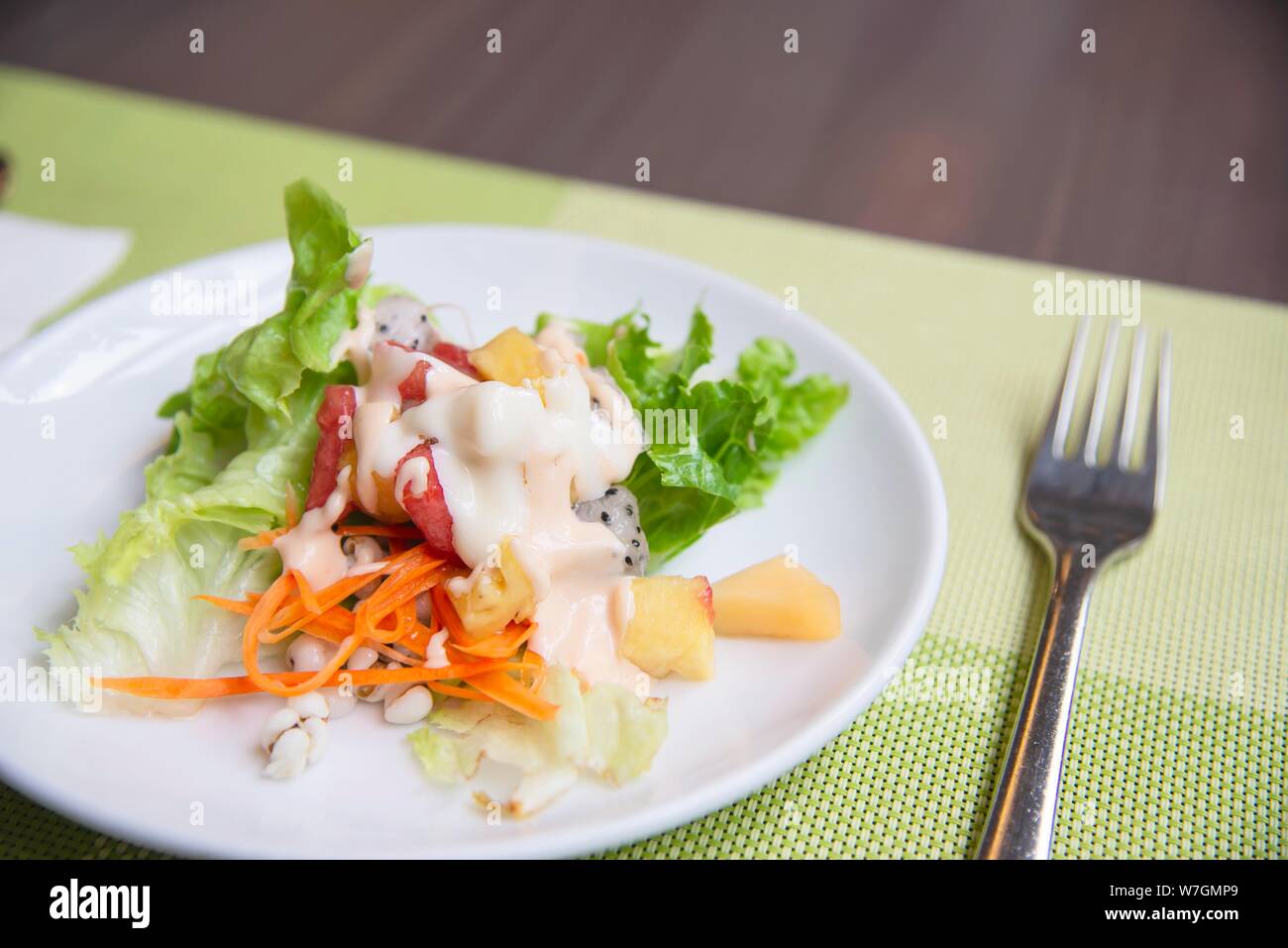 Fresh vegetable healthy salad on white plate ready for eating - fresh healthy food concept Stock Photo