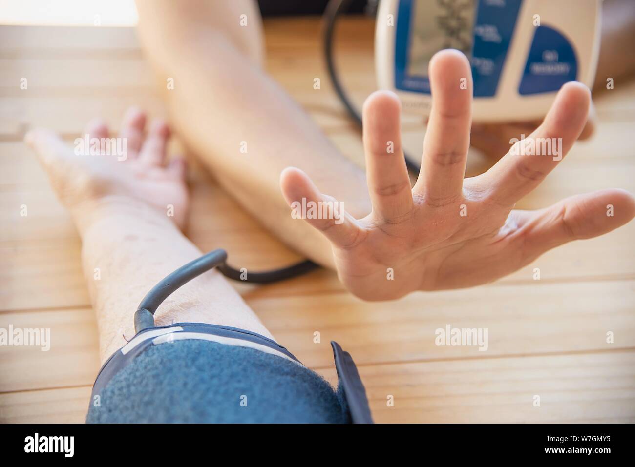 Old lady is being checked blood pressure using blood pressure monitor kid set - people with health care medical instrument set concept Stock Photo