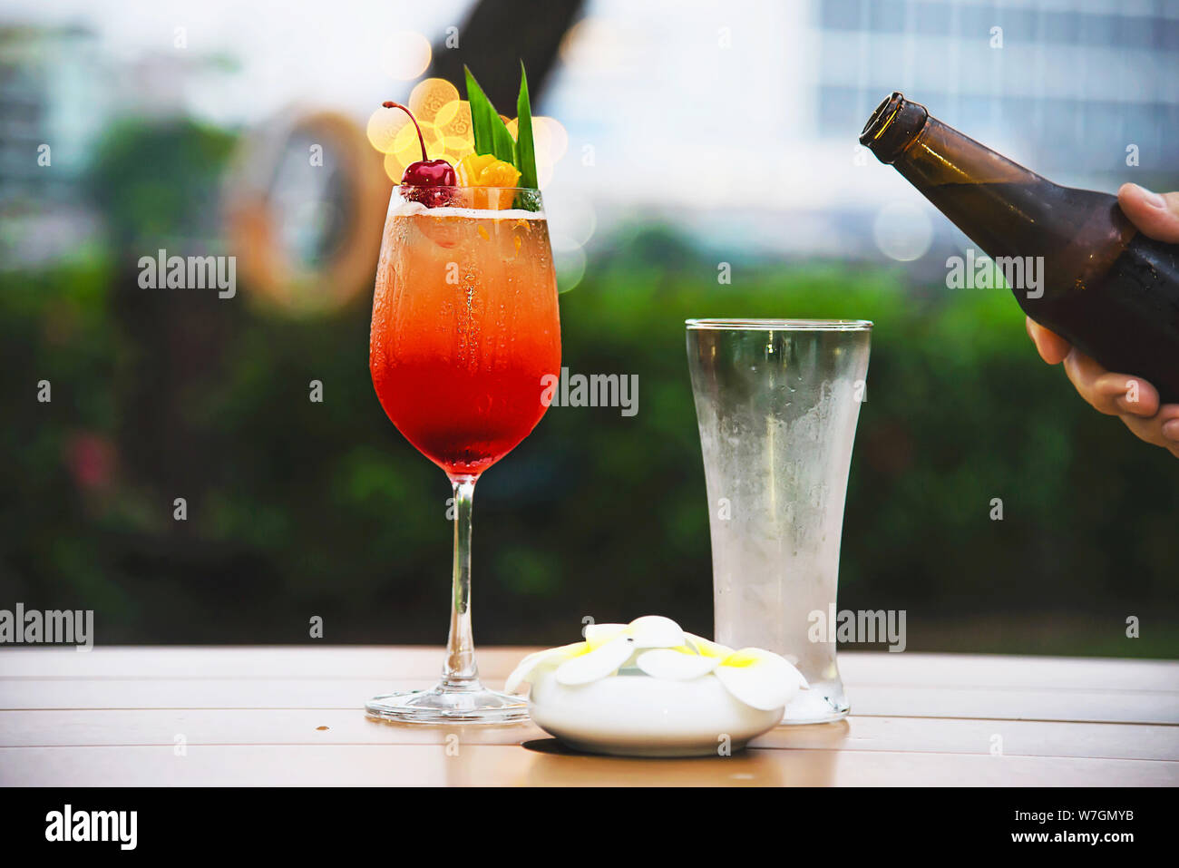 People celebration in restaurant with beer and mai tai or mai thai - happy lifestyle people with happy drink in garden concept Stock Photo