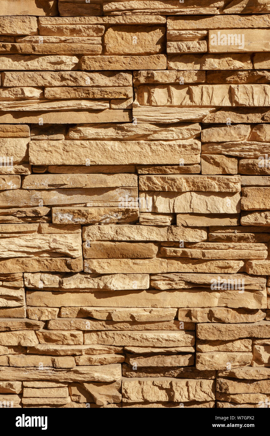 Rock stone brick tile wall has a detailed background texture sepia
