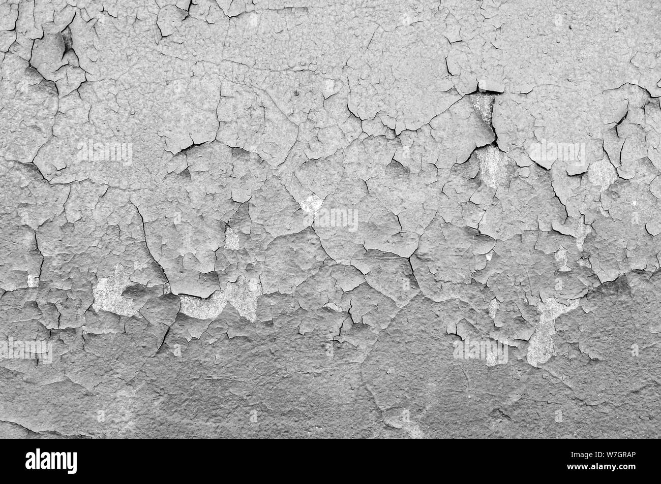 Old cracked paint on the concrete wall. Peeling paint on wall seamless texture. Pattern of