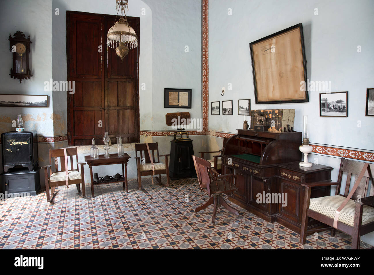 The office with colonial antique furniture in the main house of Hacienda Yaxcopoil in the Uman Municipality, state of Yucatan, Mexico on July 22, 2019. Here there is a collection of books, maps, documents and other items of historical note from when this was the administration center of the hacienda. Hacienda Yaxcopoil dates back to the 17th century and was once considered one of the most important rural estates in the Yucatan, spreading across 22,000 acres. It operated first as a cattle ranch and later as a henequen plantation during the golden age of the 'agave sisal'. Over time, due to cont Stock Photo