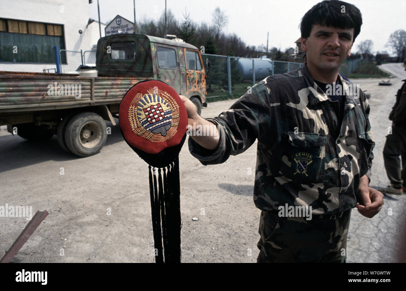26th April 1993 During the war in central Bosnia: at a military checkpoint on the road between Busovaca and Medovici, an ARBiH (Bosnian Muslim) soldier displays a Lika cap, a hat typically worn by Croats as part of their traditional costume. The Croatian flag is embroidered on the hat. Stock Photo