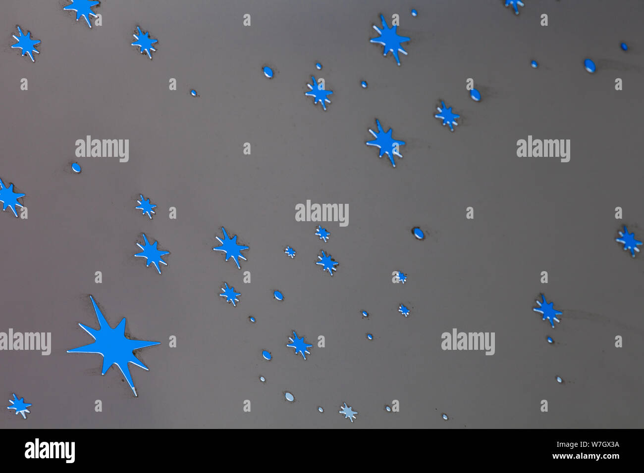 Blue sky showing through a perforated steel roof cover at the Richmond Olympic Oval British Columbia Stock Photo