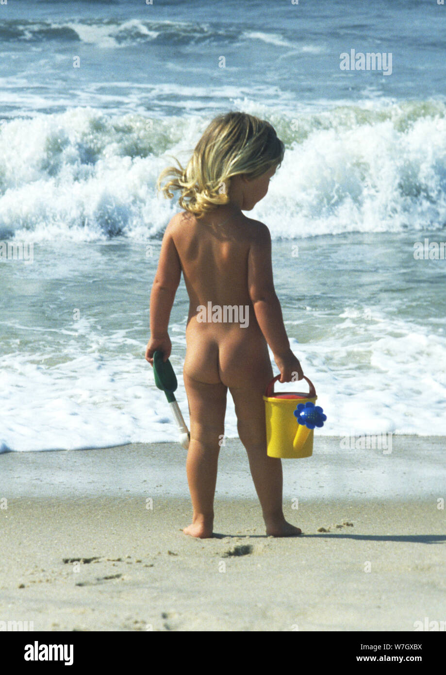 Naked child on beach Stock Photo