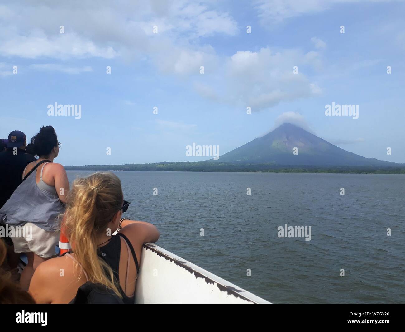 Boat to Ometepe, Nicaragua. Concepción Volcan, Lake Nicaragua. Looking at and taking photos of the island and the volcano. Stock Photo