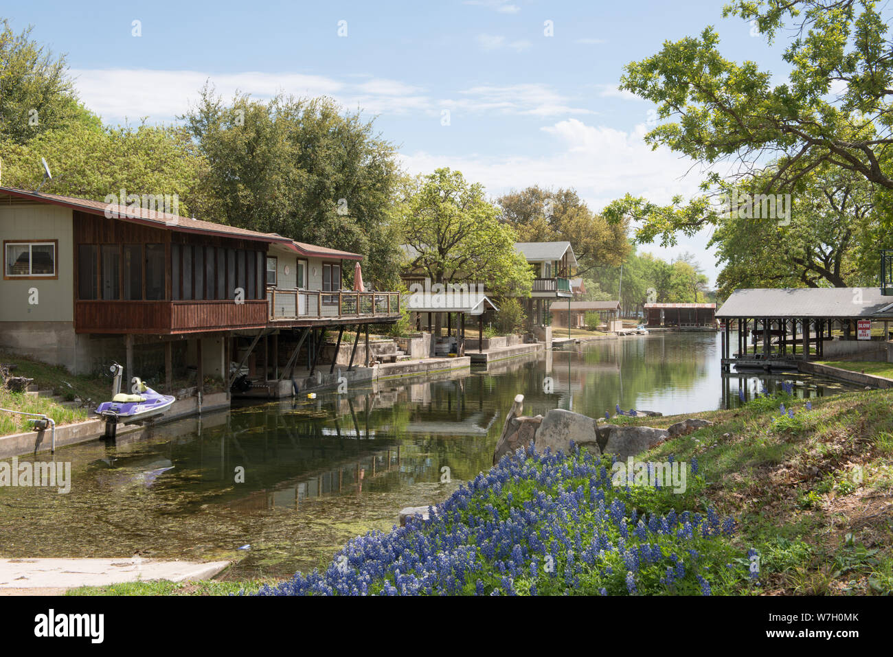 Bluebonnets And Lake Cottages Along An Inlet Of Lake Lyndon B