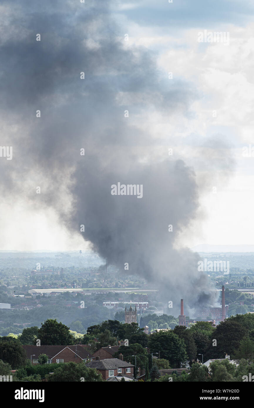 A large fire in progress on industrial units on Oxford Street East in the centre of the town of Ashton-under-Lyne, Tameside, Greater Manchester. Great Stock Photo