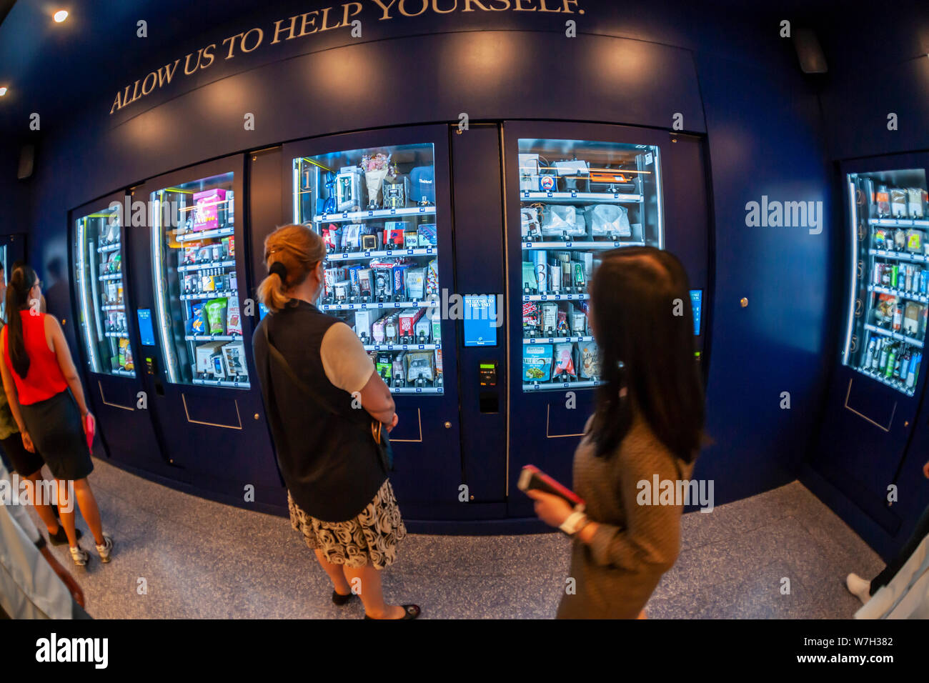 “The Vend” in Rockefeller Center in New York on its opening day, Tuesday, July 30, 2019. A product of Tishman-Speyer, the owners of Rockefeller Center, “The Vend”, installed in a vacant storefront on The Concourse, contains multiple vending machines selling everything from drinks, to Brooks Brothers shirts to a diamond engagement ring. (© Richard B. Levine) Stock Photo