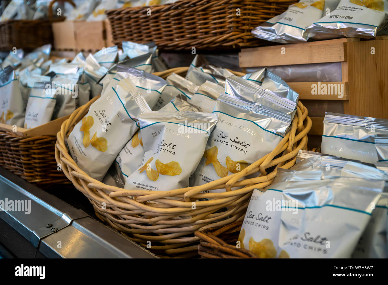 House brand potato chips fill counters that once contained produce in the Dean & DeLuca store in Soho in New York on Saturday, August 3, 2019. Facing competition from a myriad of other sources the trail-blazing Dean & DeLuca has amassed a number of unpaid bills and is not being supplied by some of its vendors. (© Richard B. Levine) Stock Photo