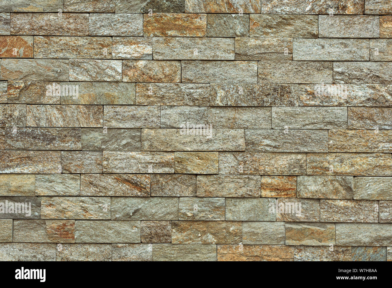 Stone brick tile as background, modern italian style wall made of tiled stone blocks Stock Photo