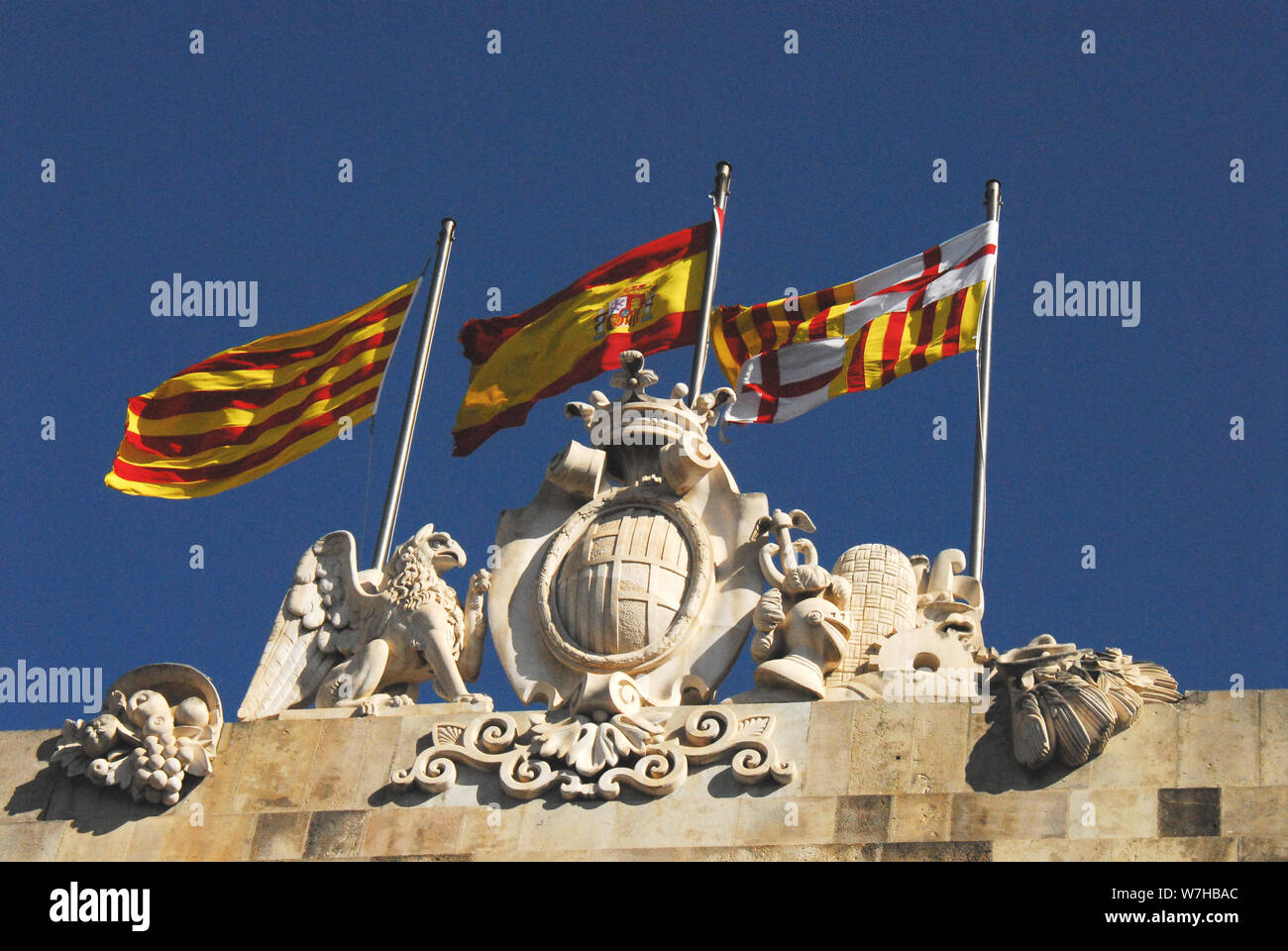 Flags Flying From Barcelona City Hall Left To Right Senyera The Flag Of Catalonia Spain Is La Rojigualda Coat Of Arms And The Barcelona City Flag Stock Photo Alamy