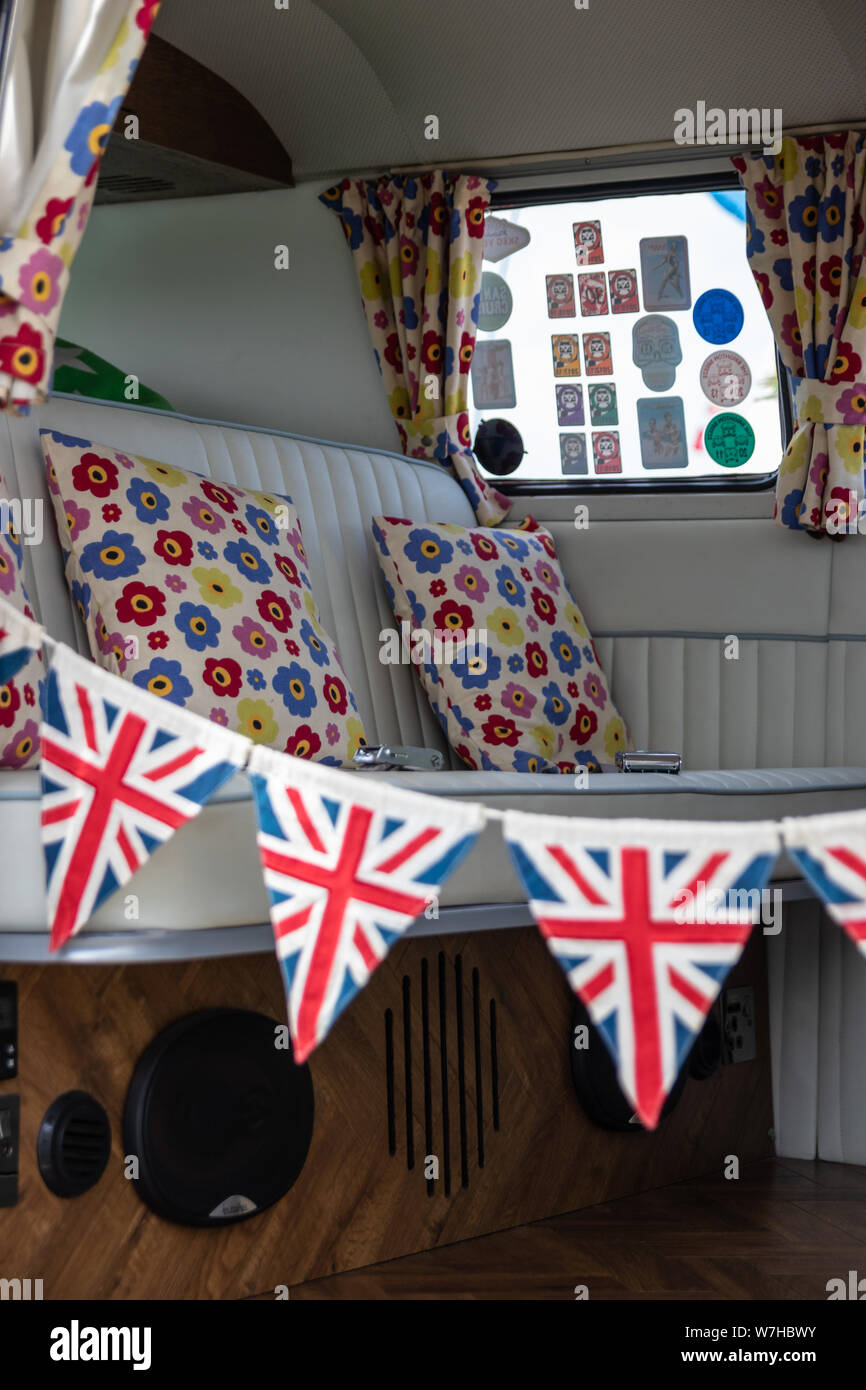 The interior of a VW or Volkswagen camper van with union jack bunting Stock Photo