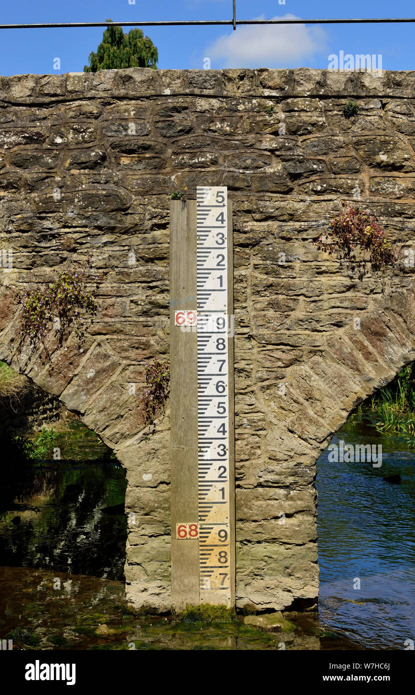 A water level measurement gauge on Goose Bridge, over the Tetbury branch of the river Avon at Malmesbury, Wiltshire. Stock Photo