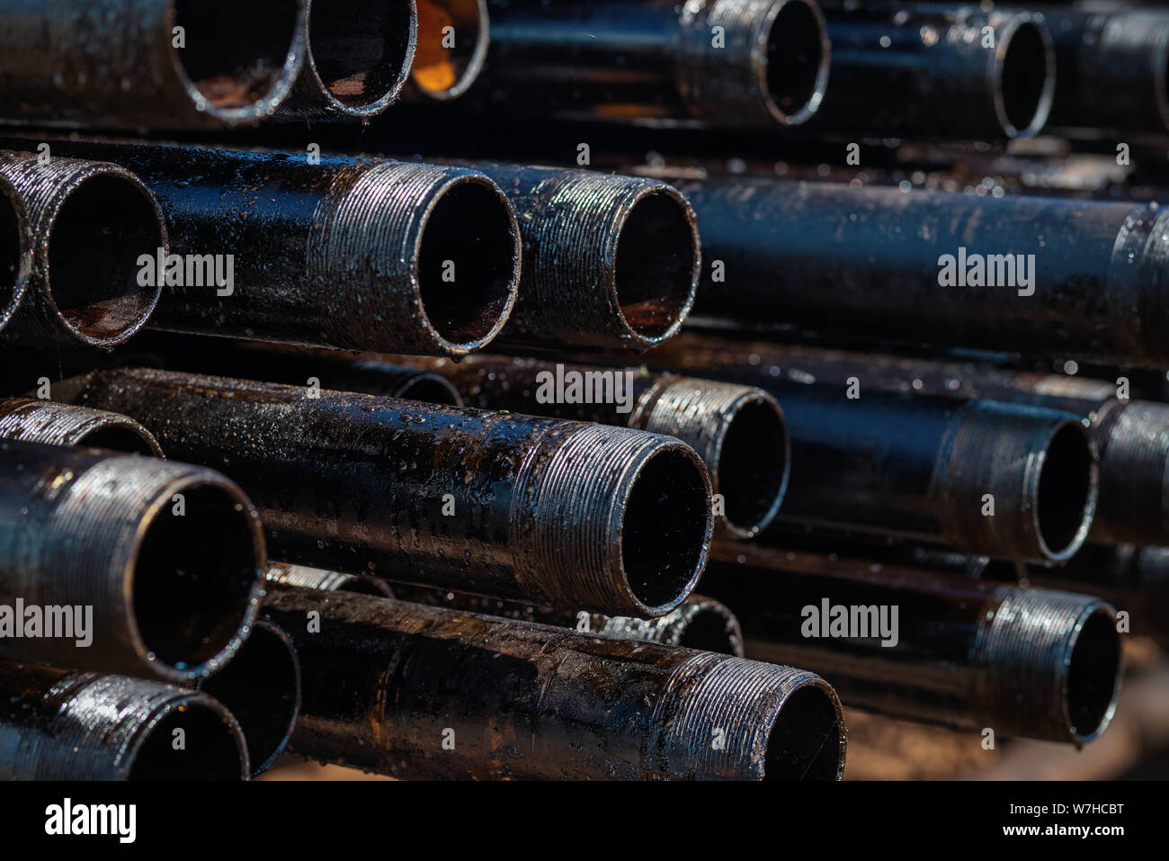 Close up drill pipe thread with pipe dope grease lay down on rig floor