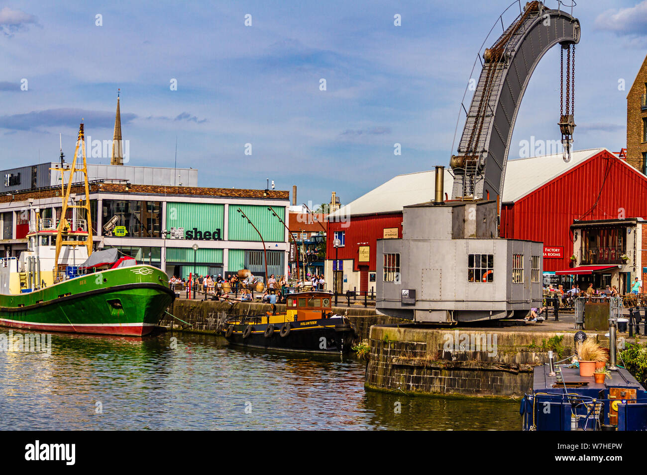 Historic vessels moored outside Bristol's M-Shed heritage museum, alongside the Fairbairn steam crane. Prince's Wharf, Bristol, UK. July 2019. Stock Photo