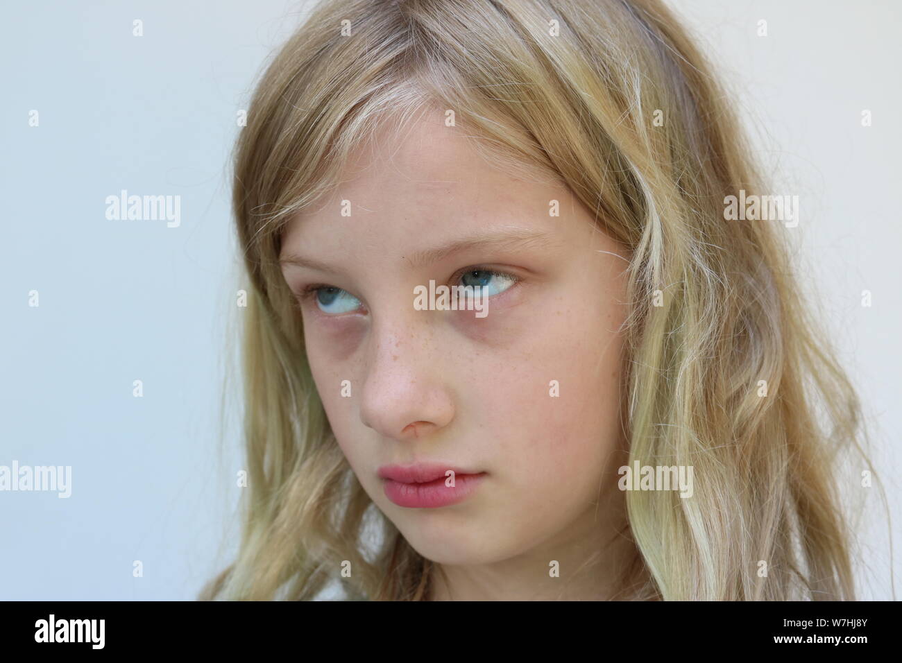 Portrait of an adolescent girl rolling her eyes Stock Photo