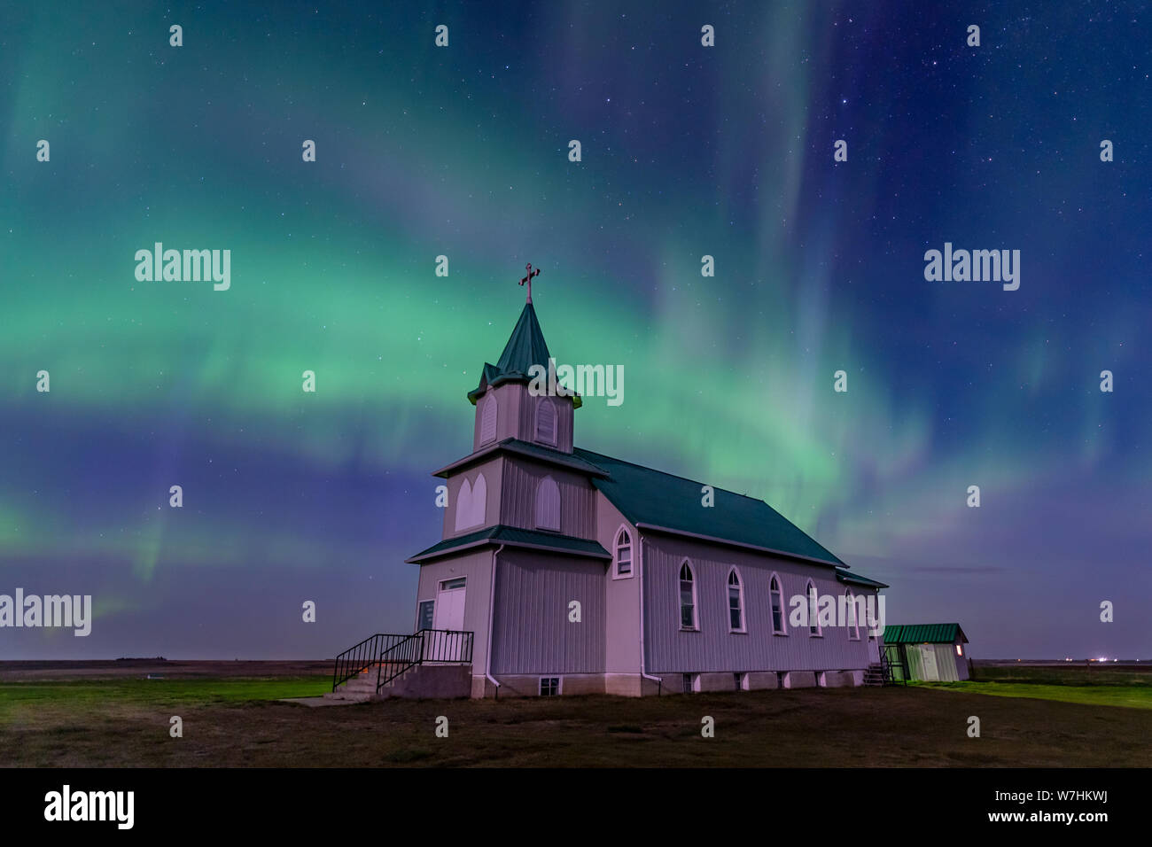 Aurora Borealis over the historic Peace Lutheran Church in Saskatchewan, Canada Stock Photo