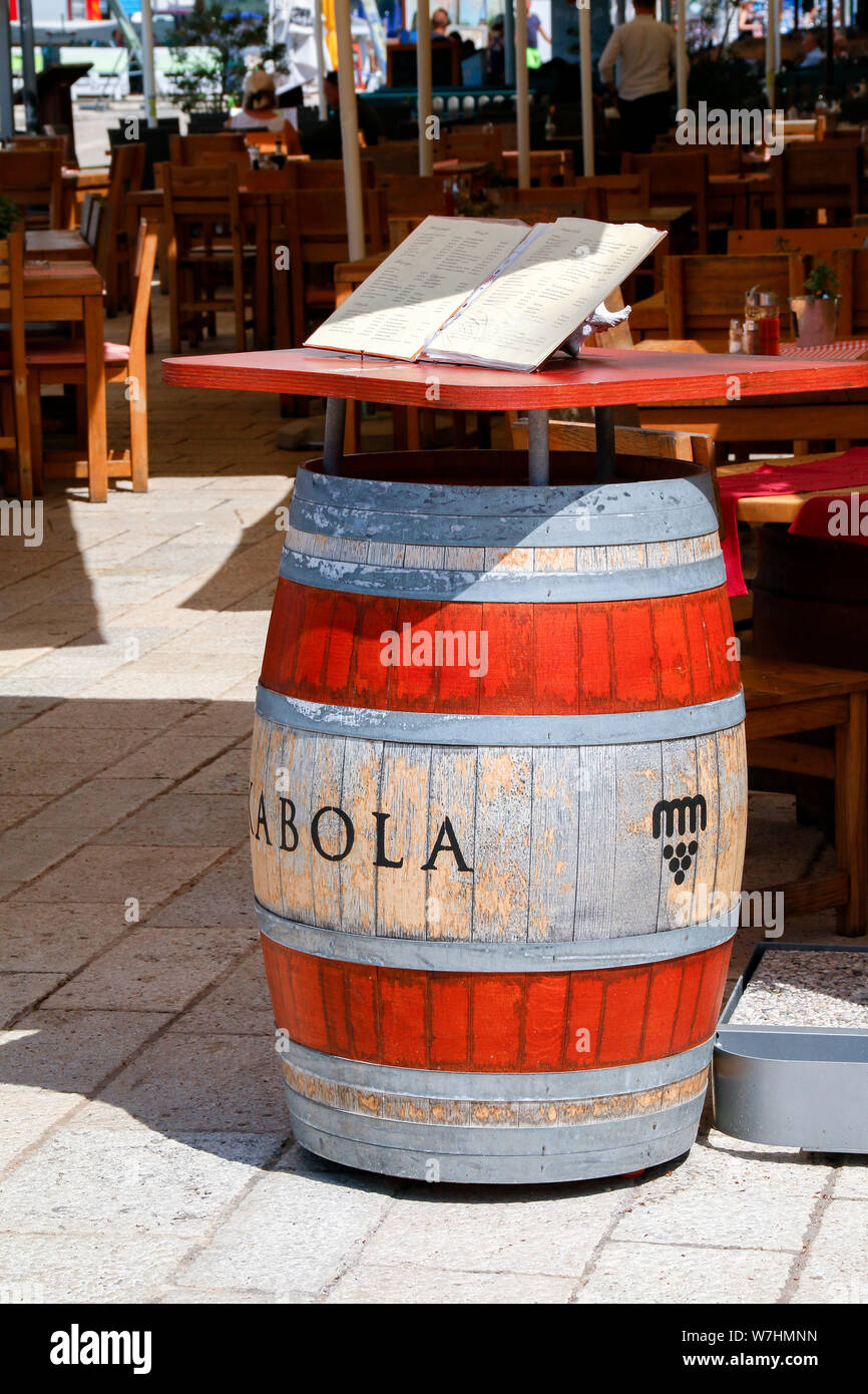 Menu sitting on top of barrel outside Stara Konoba restaurant in Fazana, Croatia Stock Photo