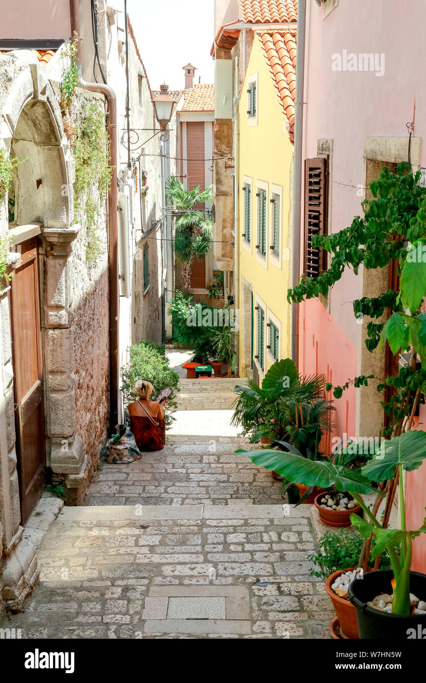 One of the narrow back streets in the historic old town of Rovinj in Croatia Stock Photo