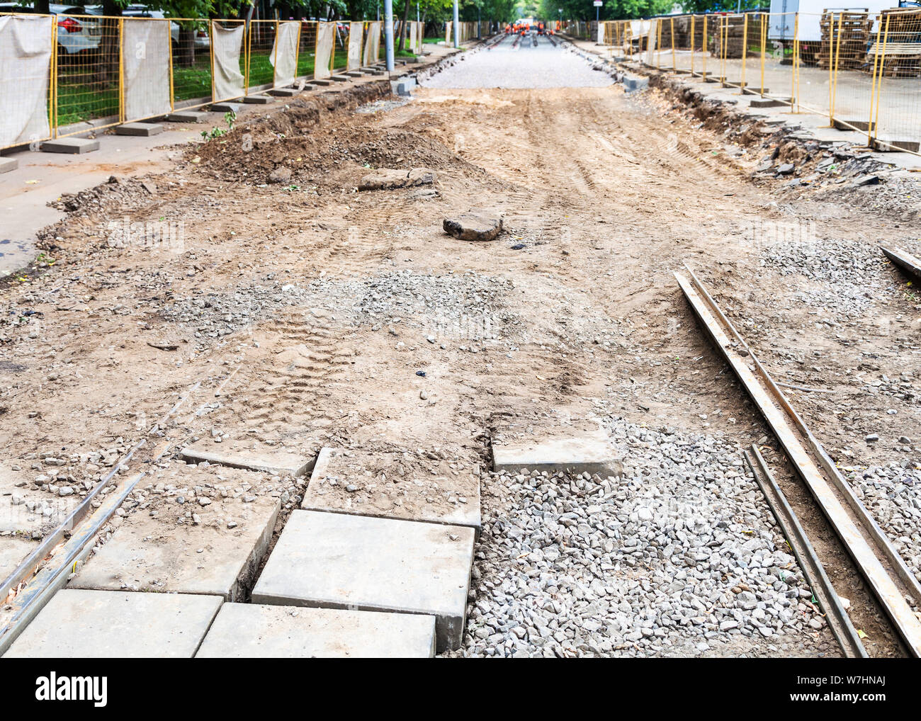 repair of tram tracks in Moscow city - broken old tram road and laying of new rails on the tram track Stock Photo