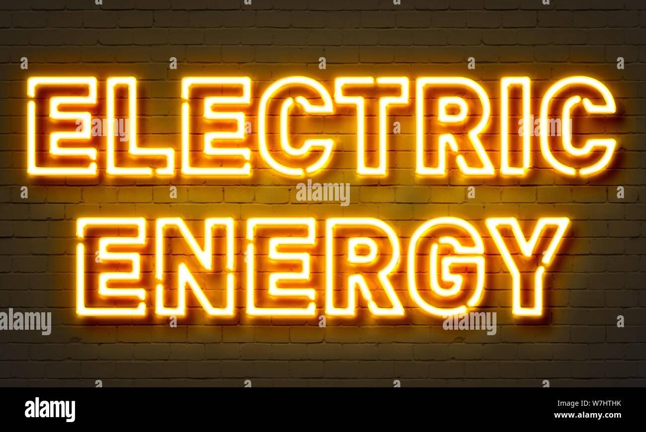 Electric energy neon sign on brick wall background Stock Photo