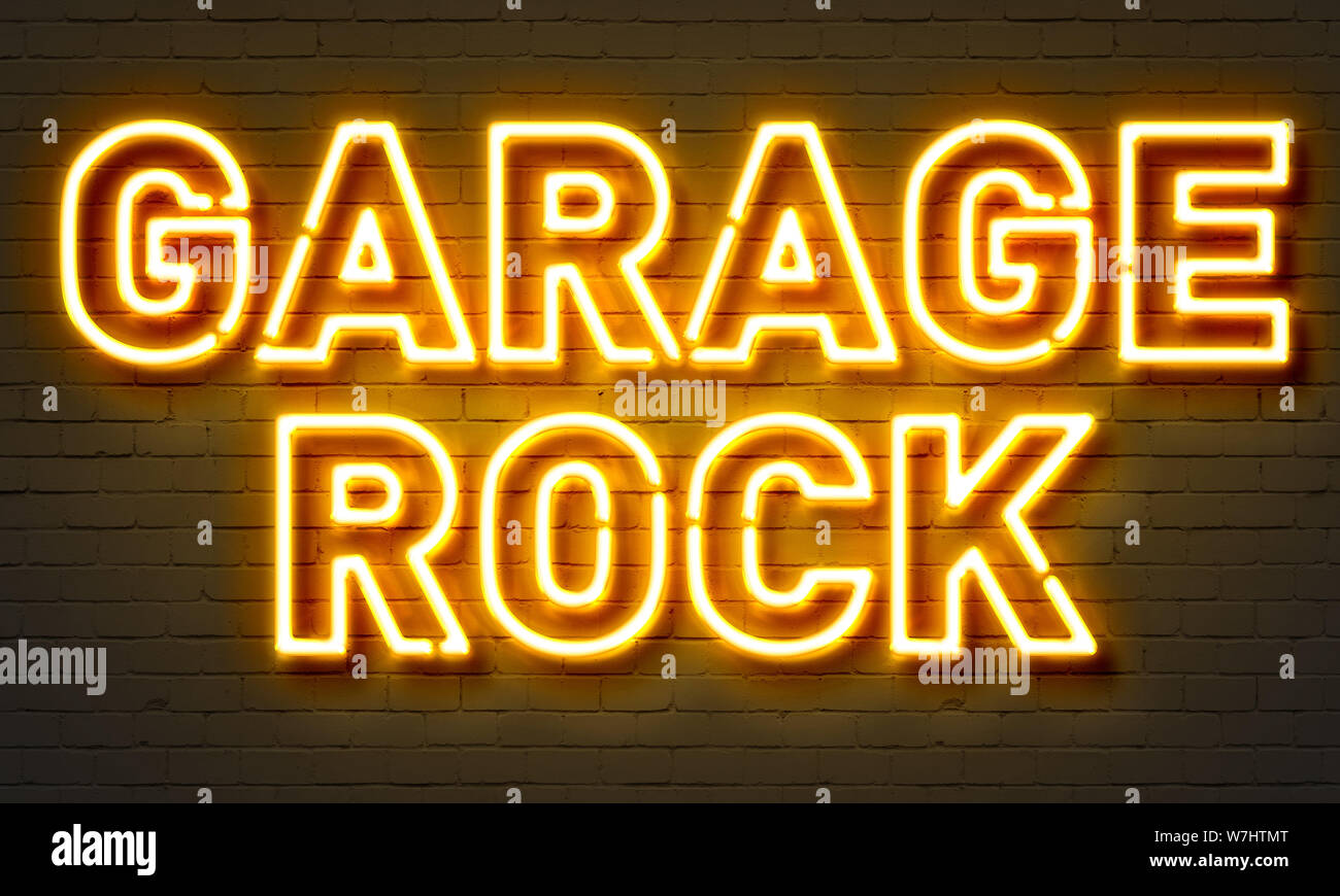 Garage Rock Neon Sign On Brick Wall Background Stock Photo