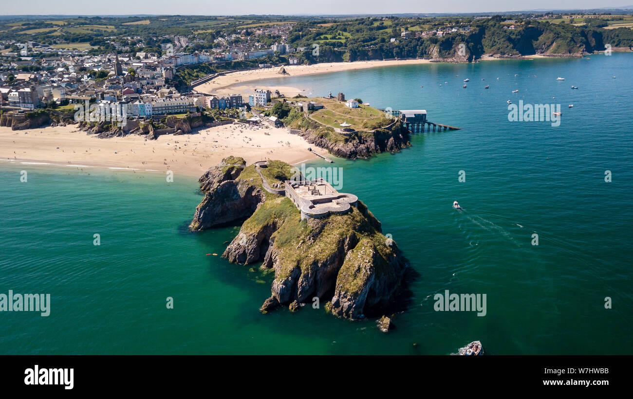 Aerial drone view of beautiful sandy beaches at a colorful, picturesque coastal town Stock Photo