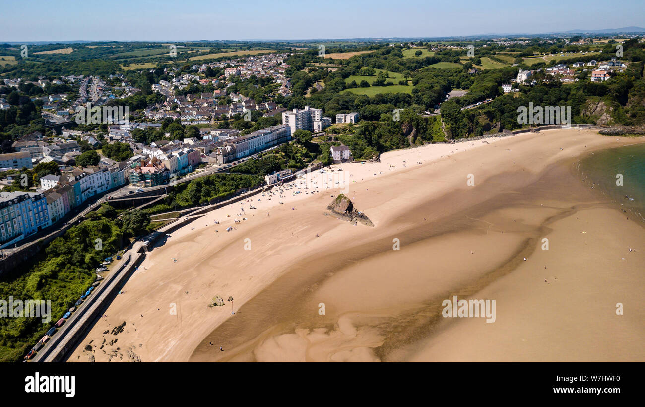Aerial drone view of colorful buildings next to the ocean in a picturesque seaside town (Tenby, Wales, UK) Stock Photo