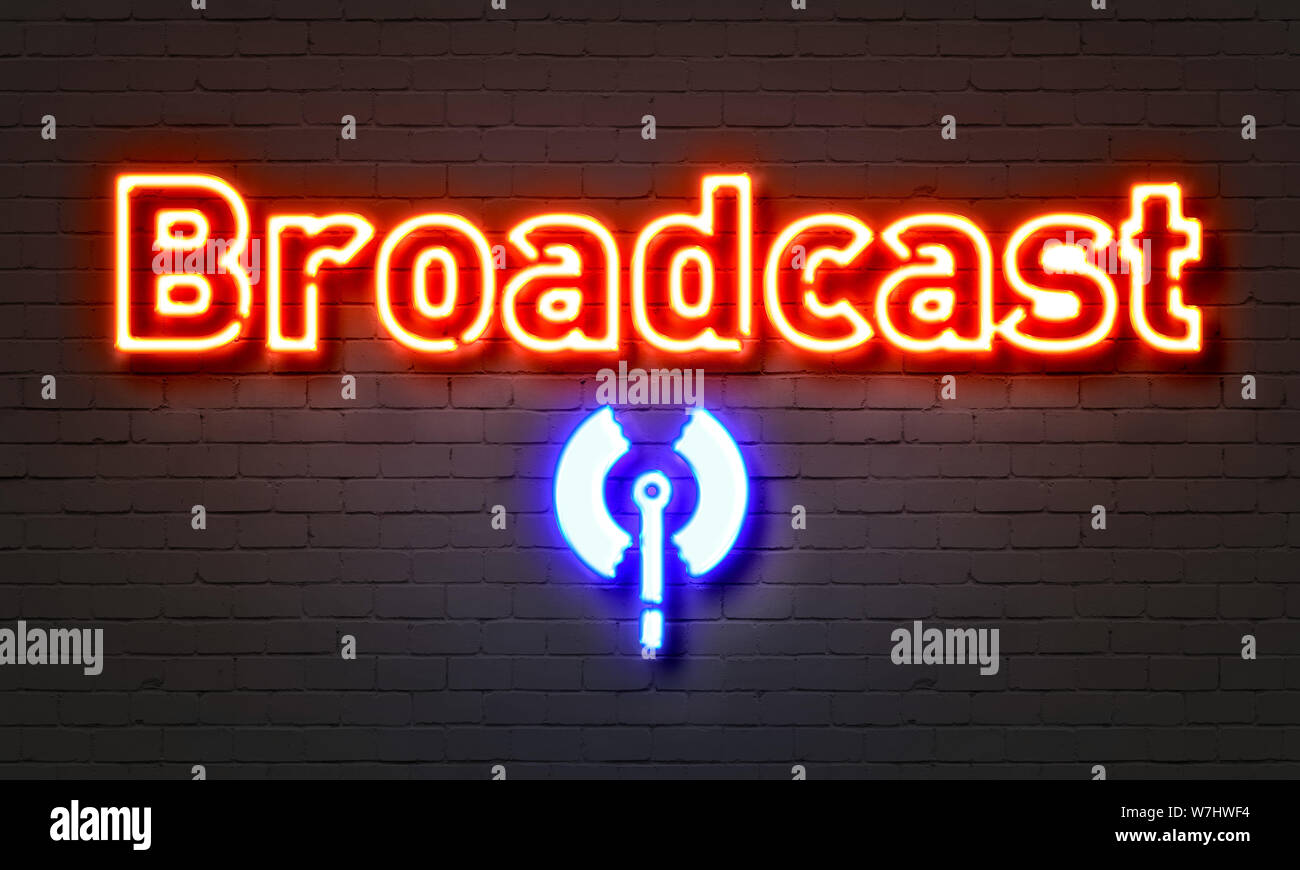 Broadcast neon sign on brick wall background Stock Photo - Alamy