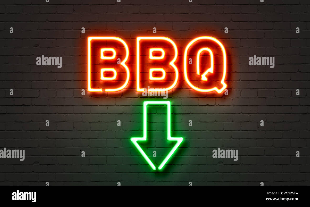 BBQ neon sign on brick wall background Stock Photo