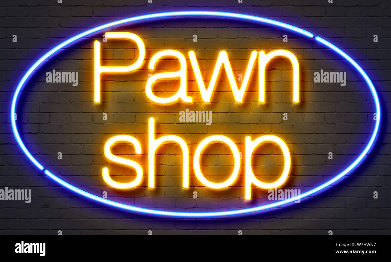 Pawn shop neon sign on brick wall background Stock Photo