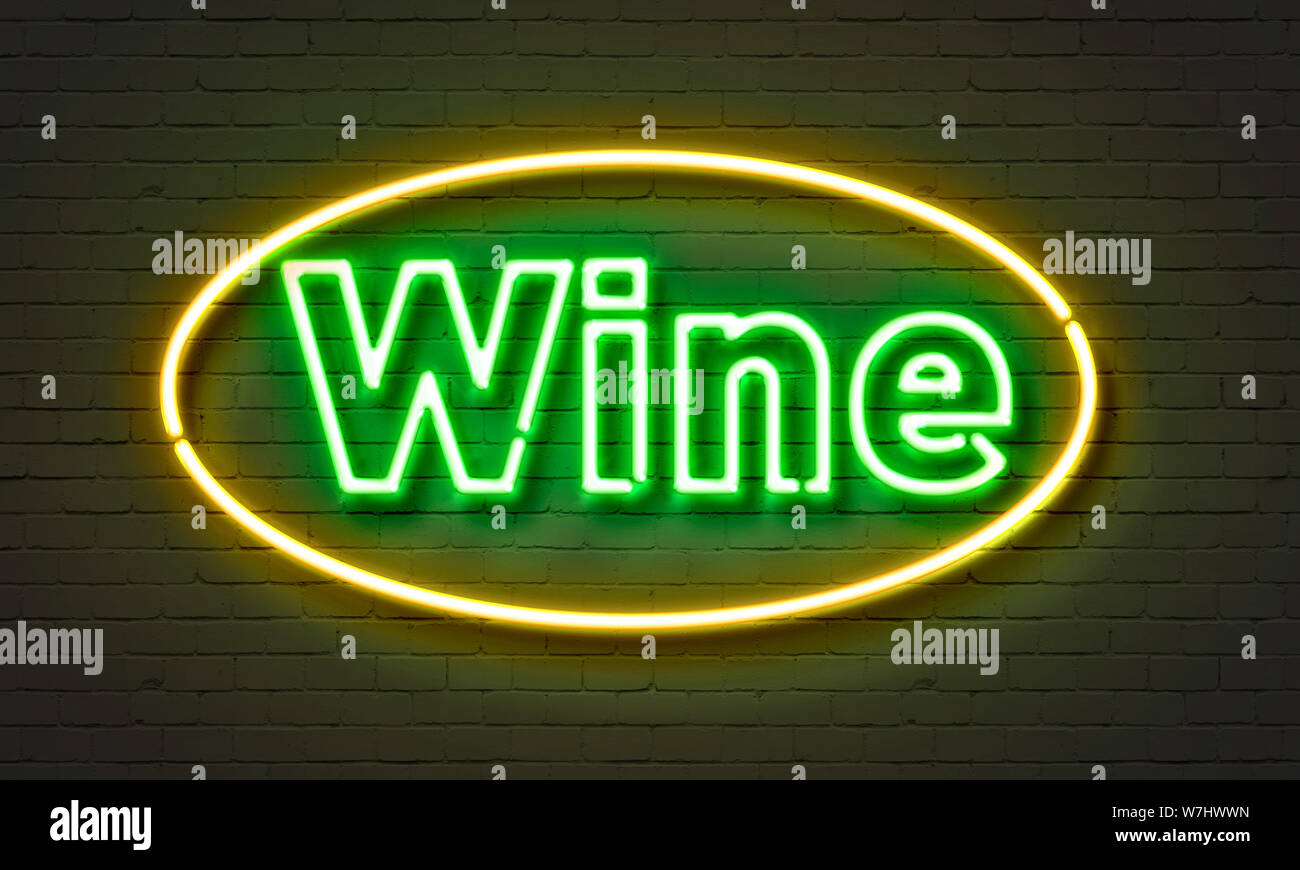 Wine neon sign on brick wall background Stock Photo