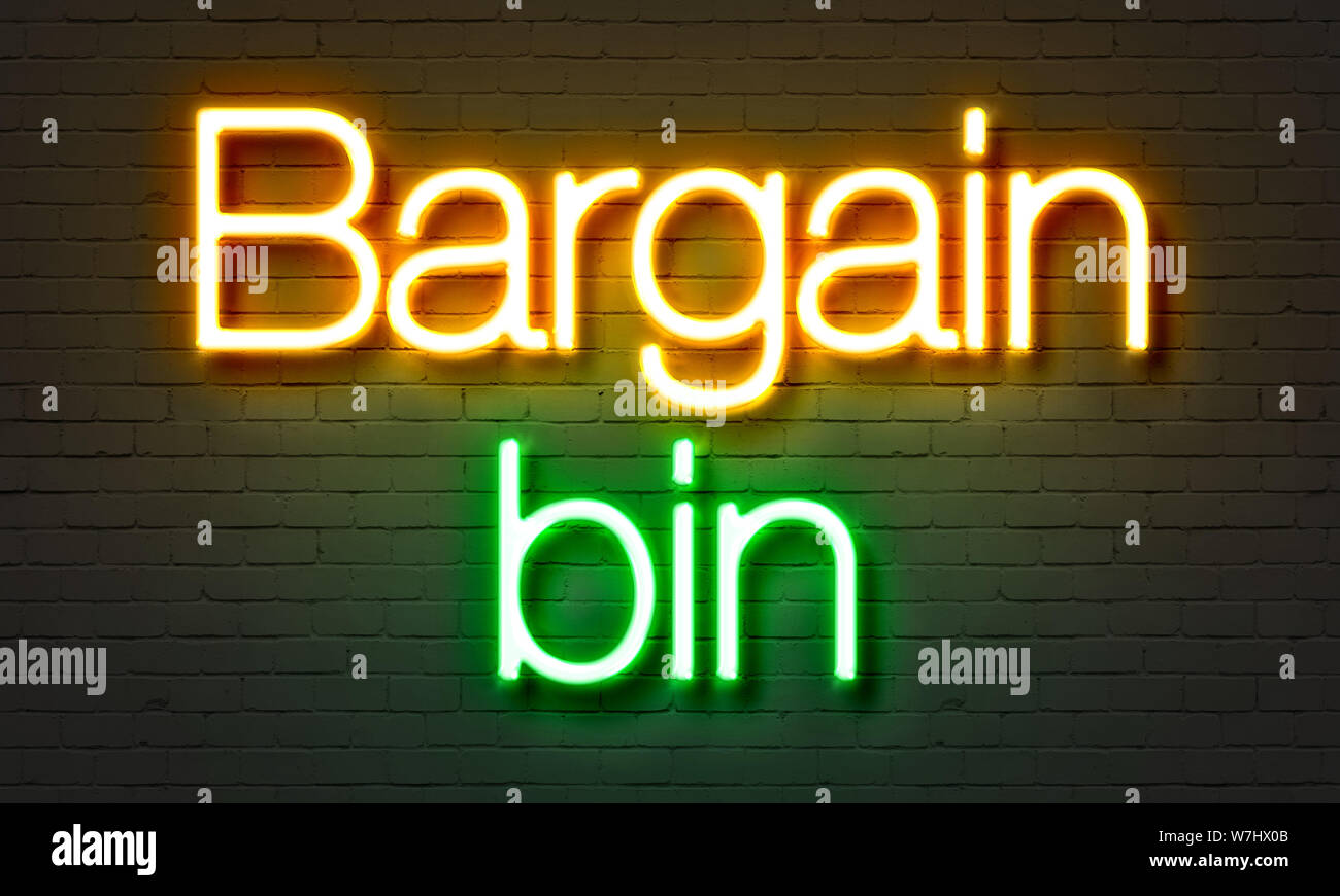 Bargain bin neon sign on brick wall background Stock Photo