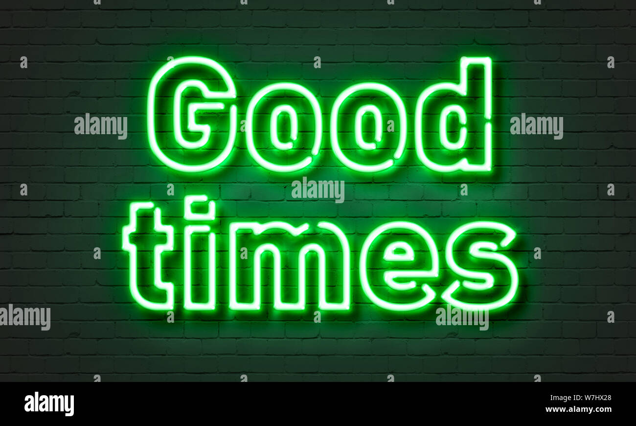 Good times neon sign on brick wall background Stock Photo