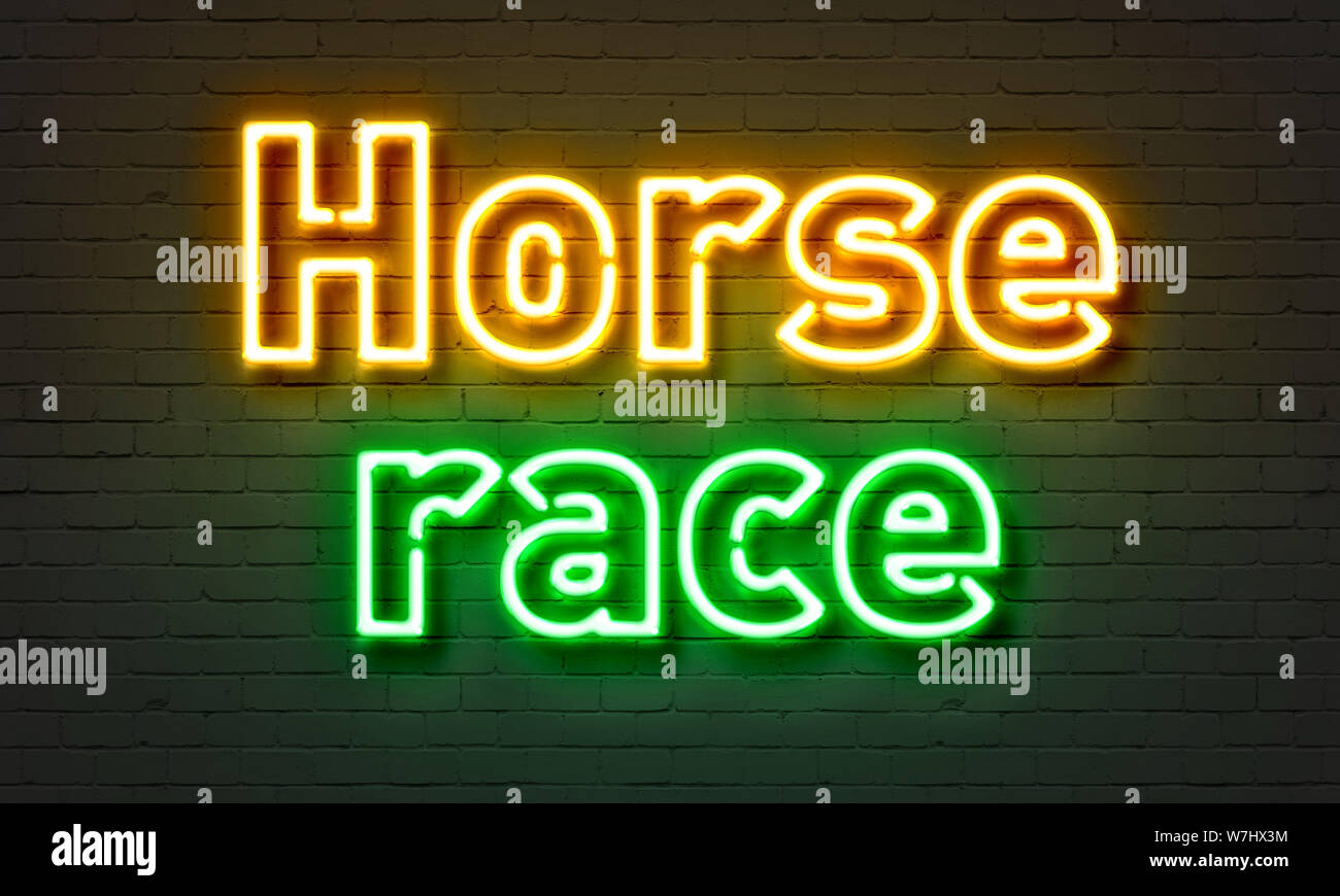 Horse race neon sign on brick wall background Stock Photo - Alamy
