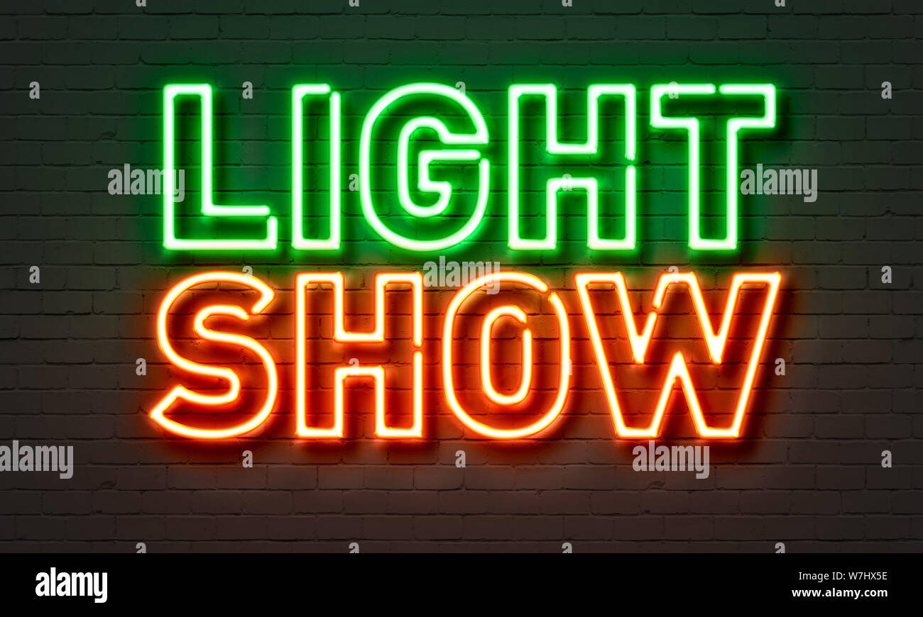 Light show neon sign on brick wall background Stock Photo Alamy