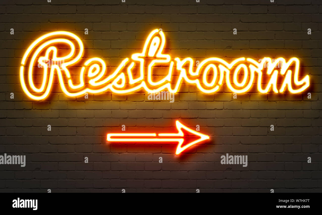 Restroom neon sign on brick wall background Stock Photo - Alamy
