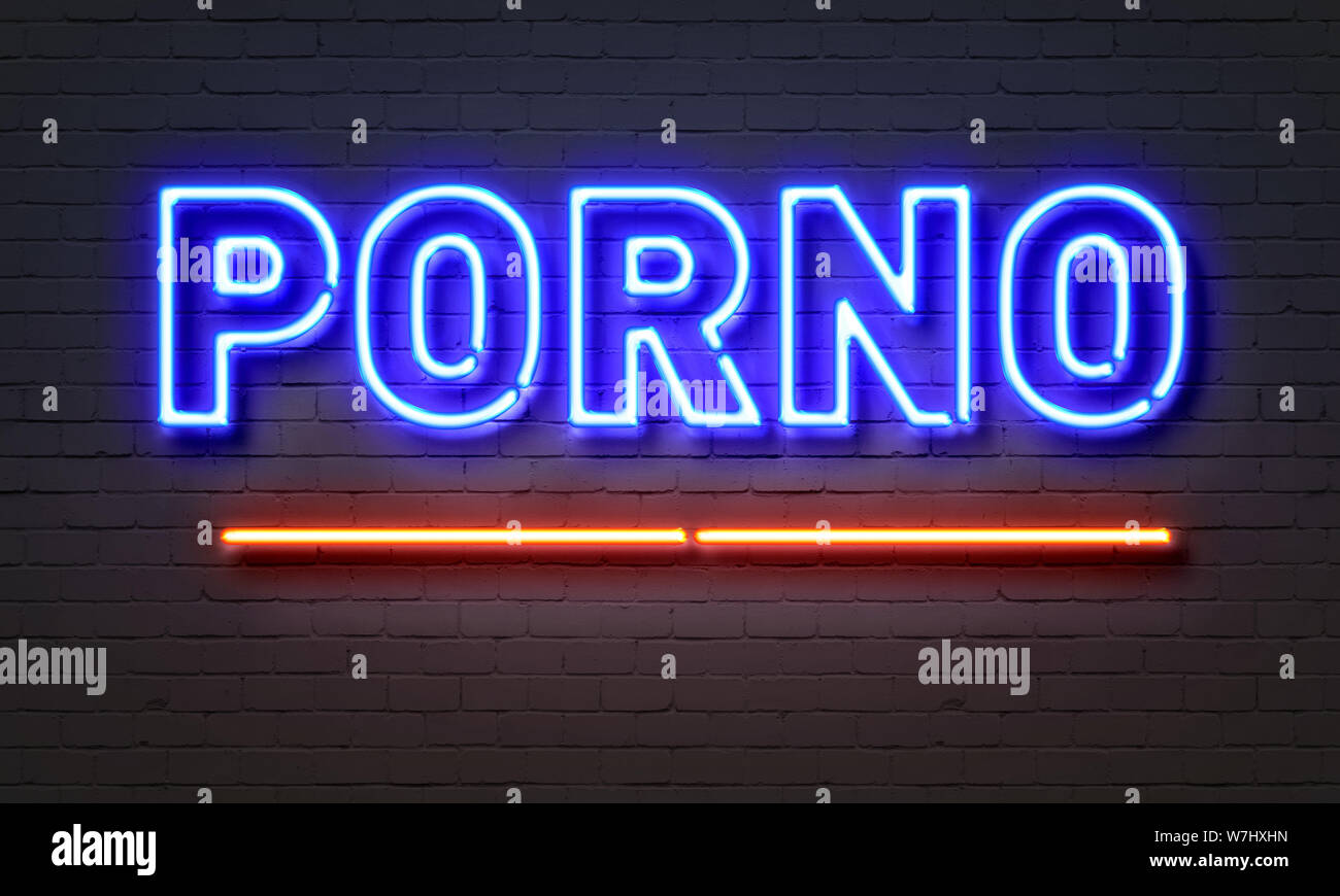 Porno neon sign on brick wall background Stock Photo