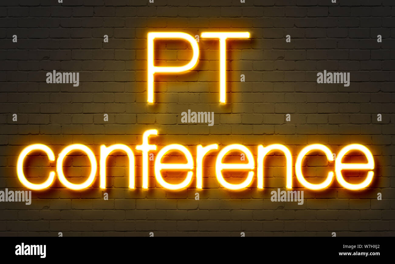 PT conference neon sign on brick wall background Stock Photo