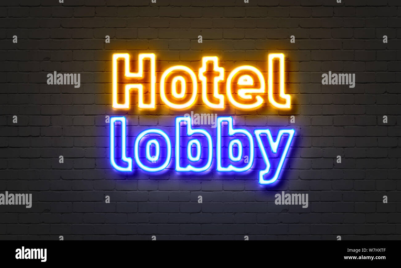 Hotel lobby neon sign on brick wall background Stock Photo Alamy
