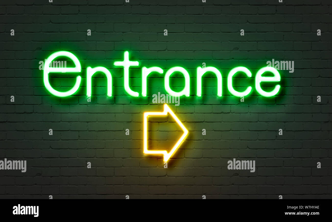 Entrance neon sign on brick wall background Stock Photo - Alamy