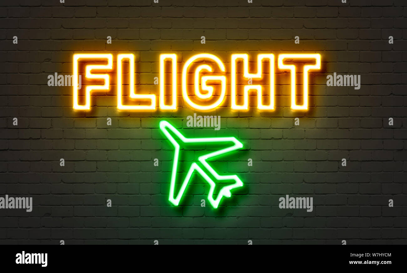 Flight neon sign on brick wall background Stock Photo - Alamy